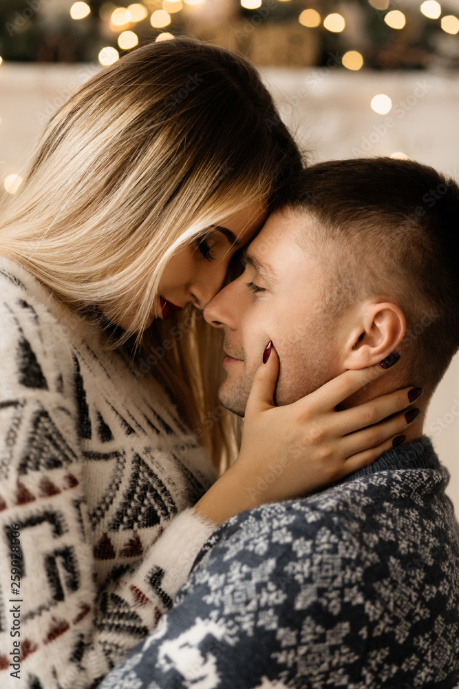 The wife kisses her husband with love The wife kisses her husband with love