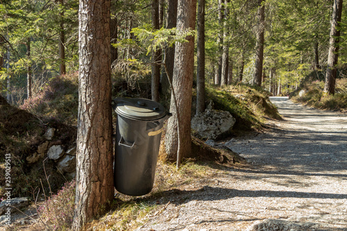 Eibsee, Germany, March 31, 2019: trash can next to the seeweg loop track. The trash cans are spread all over the place to keep it clean