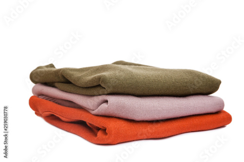 A stack of warm knitted sweaters