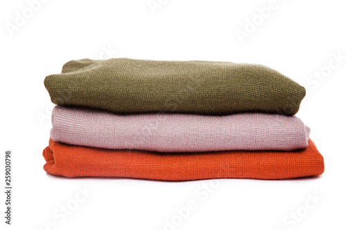 A stack of warm knitted sweaters