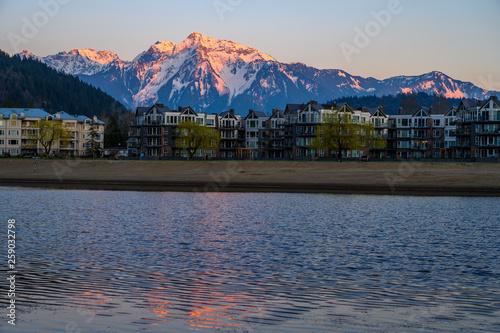 Harrison Hot Springs in Fraser Valley, British Columbia with the lagoon in the foreground and in the background, the snow-caped Mount Cheam in a beautiful sunset light photo