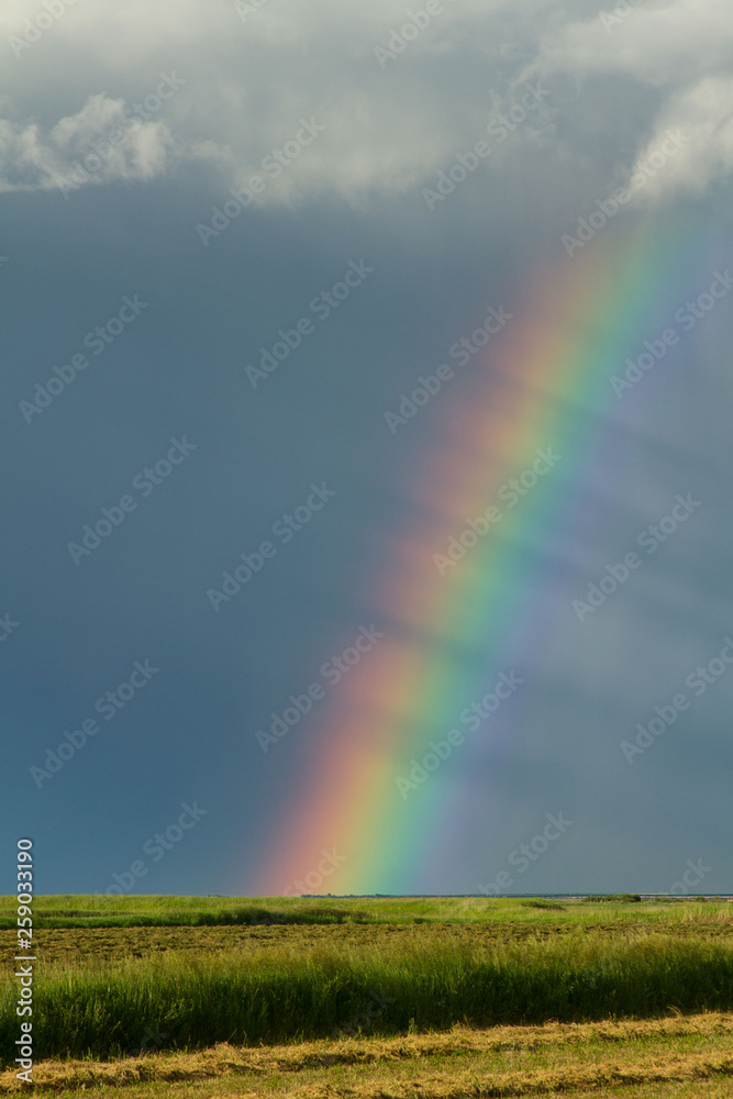 Stormy Rainbow over Hay Field Stormy Rainbow over Hay Field