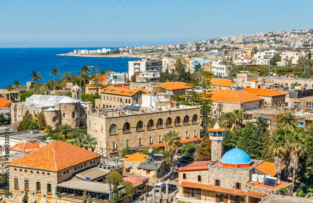 Mediterranean city historic center panorama with old church and mosque and residential buildings in the background, Biblos, Lebanon