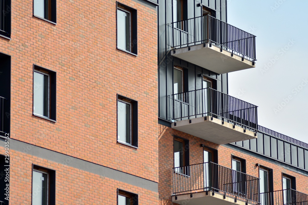 Fototapeta premium Fragment of a modern apartment building in front. Very modern apartment house.