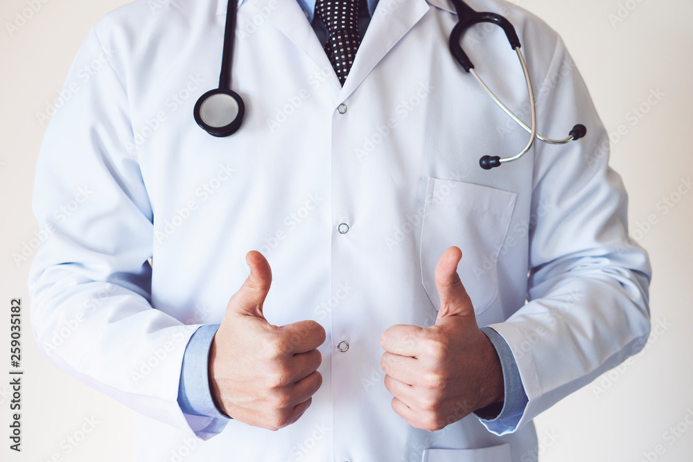Doctor man showing an ok sign with fingers