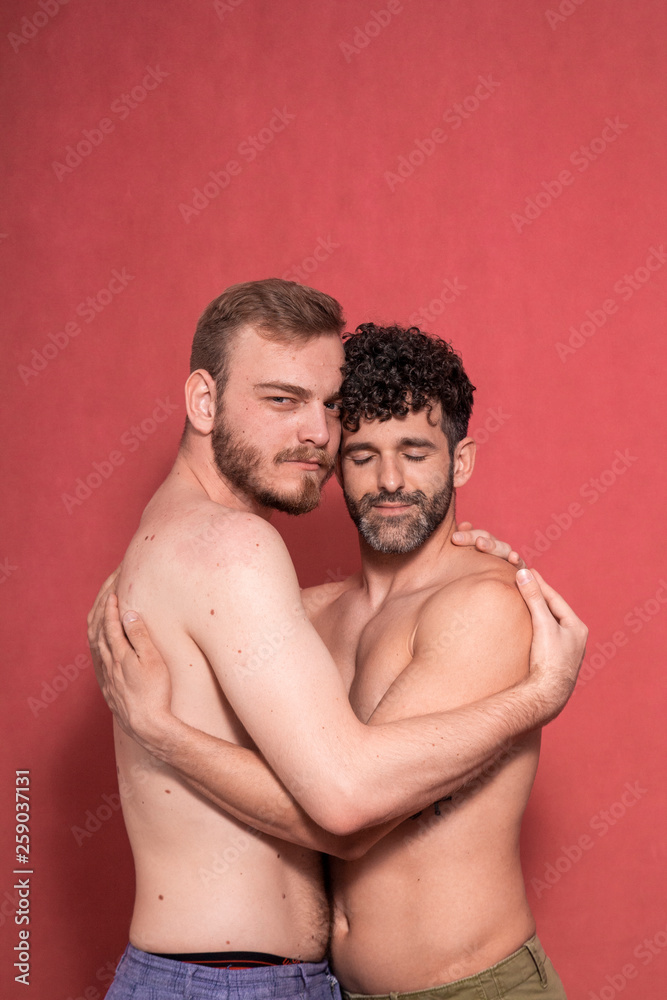 sexy gay couple, hugging each other. Stock Photo | Adobe Stock
