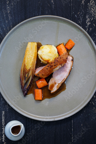 Roast duck with braised chickory and dauphinoise potatoes