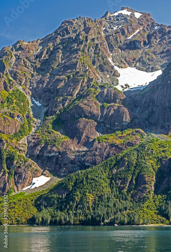 Glaciers and fog lie around the mountains in Seward Bay, Alaska.