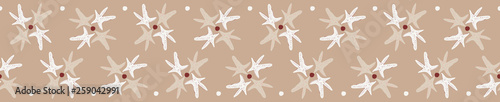 Beach sea star seamless pattern. Starfish form flower shapes repeating on a brown sandy background. Great for wedding, spa or resort stationery, textiles, gift wrapping ribbon or product packaging.