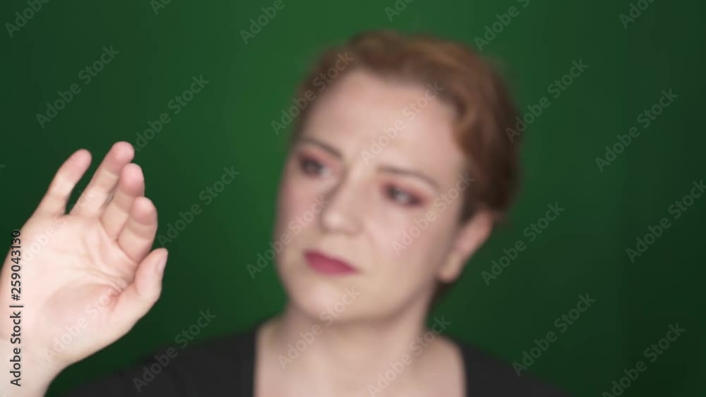 Woman touching invisible screen Woman touching invisible screen