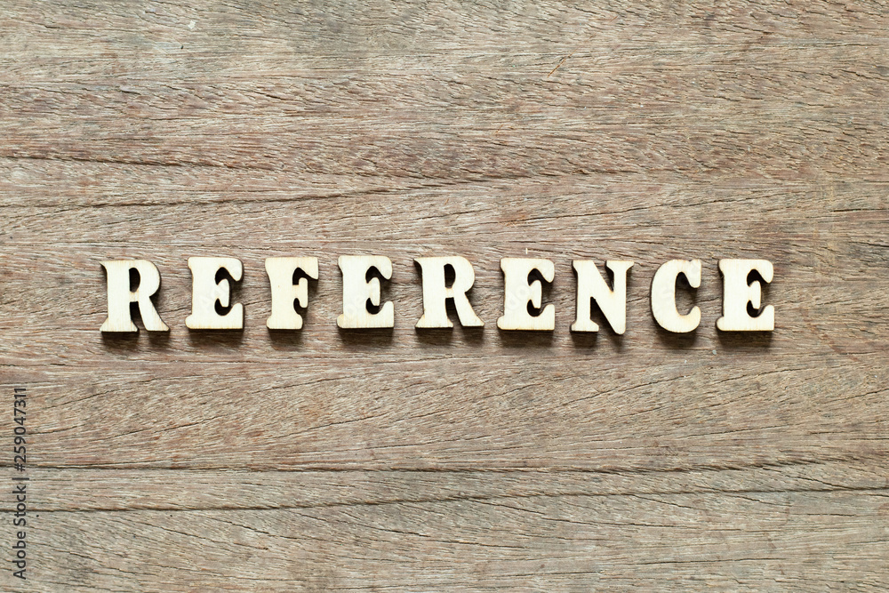 Letter block in word reference on wood background Letter block in word reference on wood background