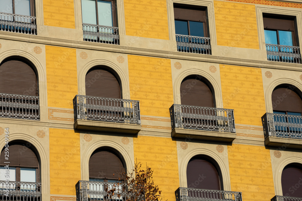 Old building facade and balconies on Passeig de Gracia Avenue (Paseo de Gracia). Barcelona, Spain