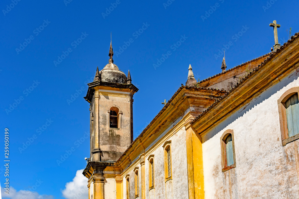 Old catholic bell church tower and facade of the 18th century located in the center of the famous and historical city of Ouro Preto in Minas Gerais
