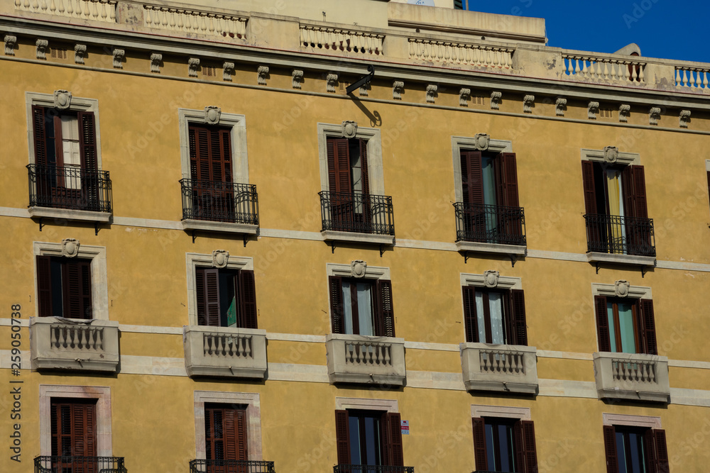 Old building facade ands balconies. Barcelona, Spain