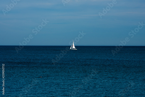 View of a sailboat in the Mediterranean sea. Barcelona, Spain