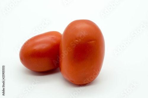 two tomatoes isolated on white background
