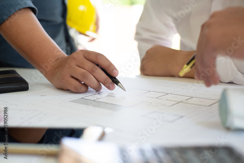 Team of architects people in group on construction site check documents.concept