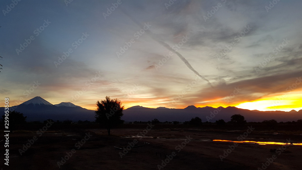 Wonderful sunrise on the volcanoes of the Andean cordillera in northern Chile, Atacama Desert, Chile