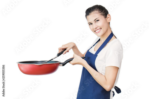 Portrait of Cheerful Asian Woman Having Fun While Cooking with pan Isolated On White. Happy housewife holding pan, housekeeper maid service concept