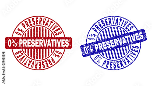 Grunge 0% PRESERVATIVES round stamp seals isolated on a white background. Round seals with grunge texture in red and blue colors.