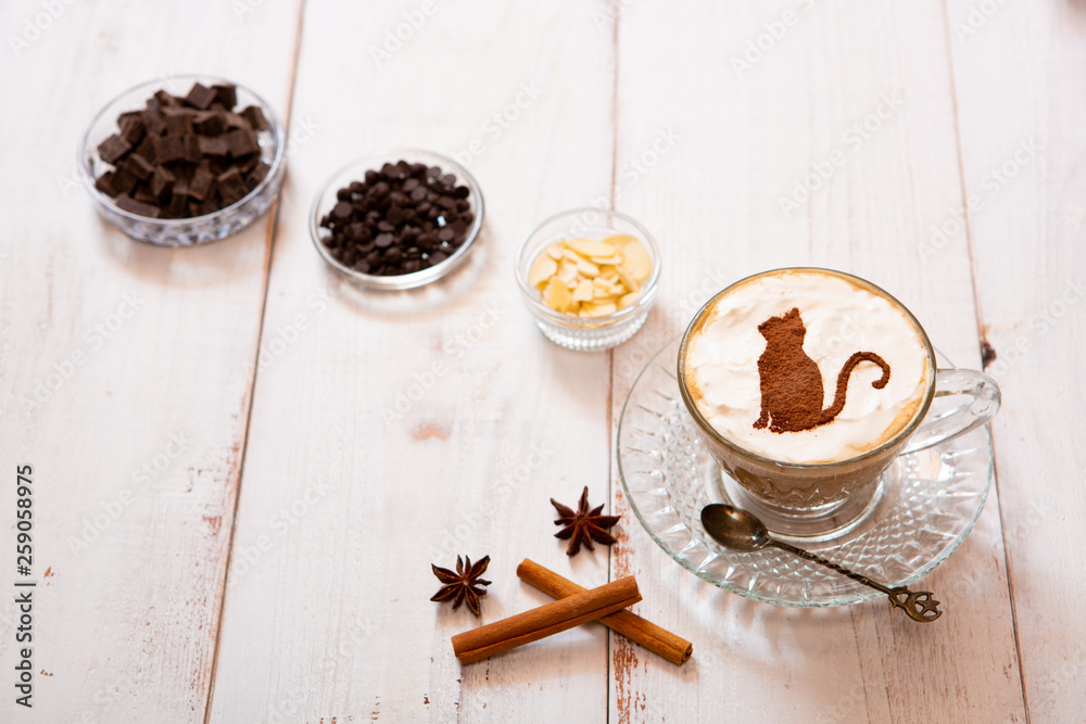 cat mark decorated on cup of hot chocolate cat mark decorated on cup of hot chocolate