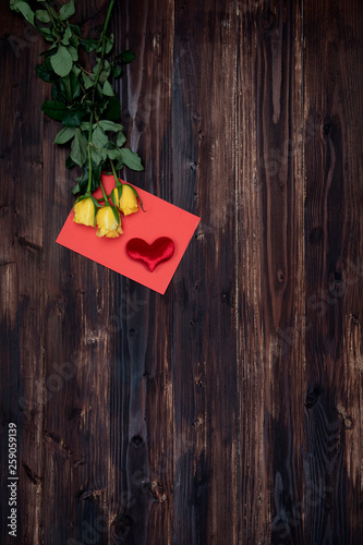 Valentine love card fresh rose and heart on wooden