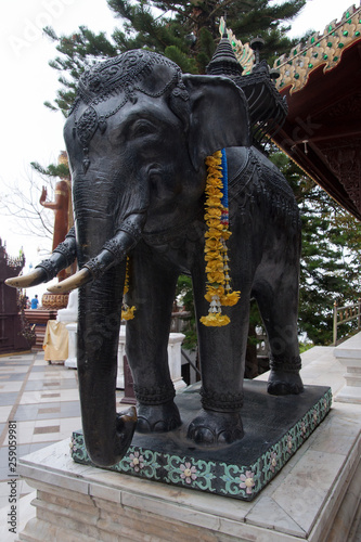 Chiang Mai Thailand, statue of black elephant with string of marigold flowers at Wat Phra That Doi Suthep 