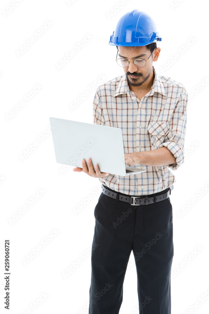 Engineer man blue helmet typing notebook Engineer man blue helmet typing notebook