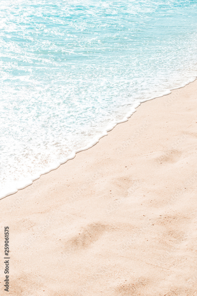 Blue ocean wave on sandy beach. Summer day and sand beach background Blue ocean wave on sandy beach. Summer day and sand beach background