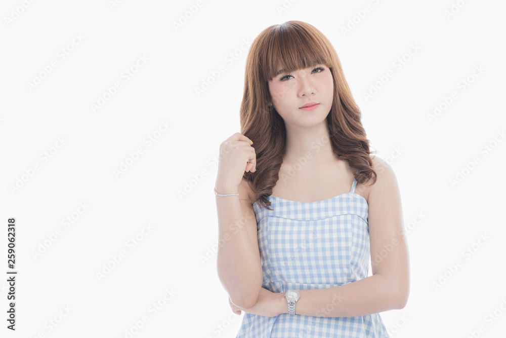 Front view close-up portrait of young beautiful Asian woman with curly long dark brown hair in light blue checked dress stand up straight isolated white background Front view close-up portrait of young beautiful Asian woman with curly long dark brown hair in light blue checked dress stand up straight isolated white background