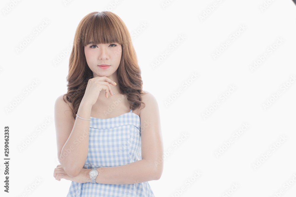Front view close-up portrait of young beautiful Asian woman with curly long dark brown hair in light blue checked dress stand up straight isolated white background Front view close-up portrait of young beautiful Asian woman with curly long dark brown hair in light blue checked dress stand up straight isolated white background