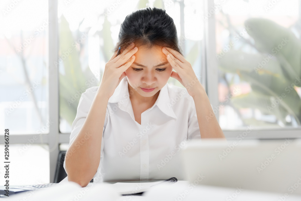 Tired Asian Business Woman with headache at office, visual migraine, retinal migraine, monocular migraine. Feeling sick at work. Thinking overworking in job concept Tired Asian Business Woman with headache at office, visual migraine, retinal migraine, monocular migraine. Feeling sick at work. Thinking overworking in job concept