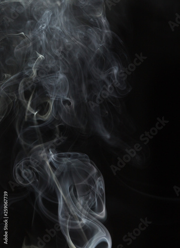 Abstract white smoke on black background © donikz