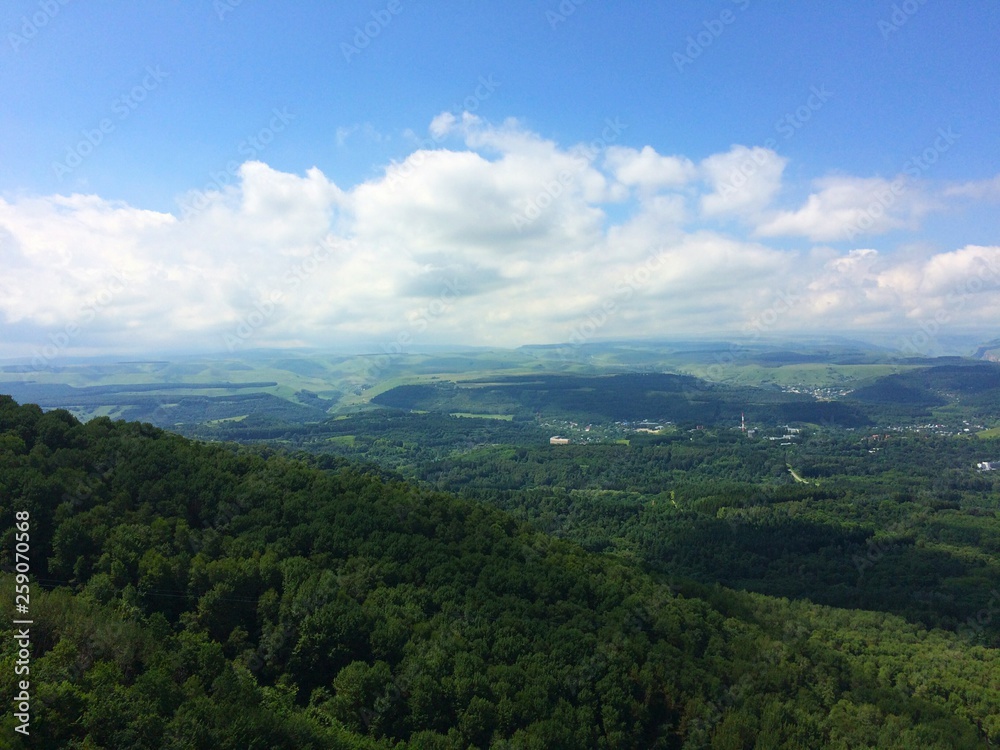 mountains overgrown with green forest north caucasus rocks blue sky sunny summer day nature landscape