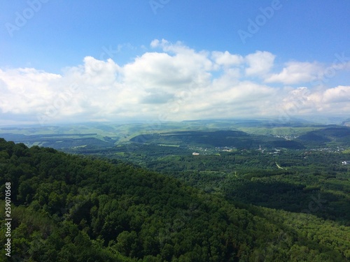 mountains overgrown with green forest north caucasus rocks blue sky sunny summer day nature landscape