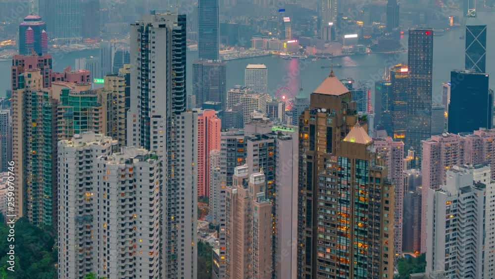 Day to night close up view of skyscrapers and Hong Kong cityscape. Hong Kong, China - February, 2019. Timelapse 4K