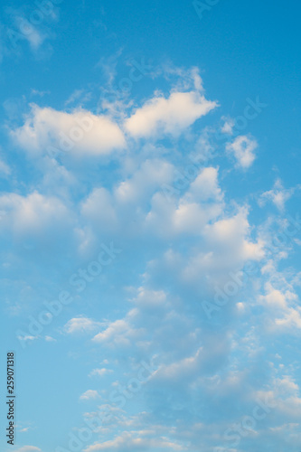 Blue sky with clouds background.