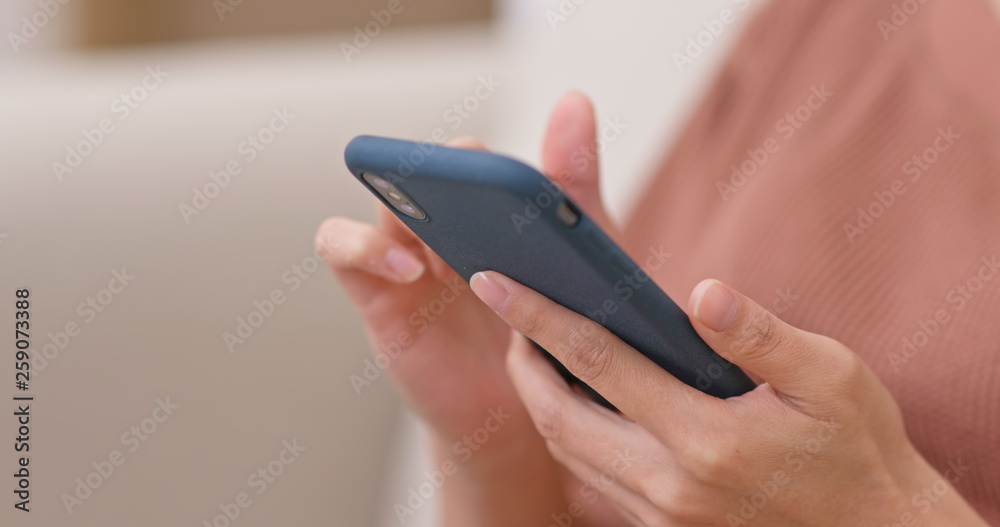Woman use of smart phone at home Woman use of smart phone at home