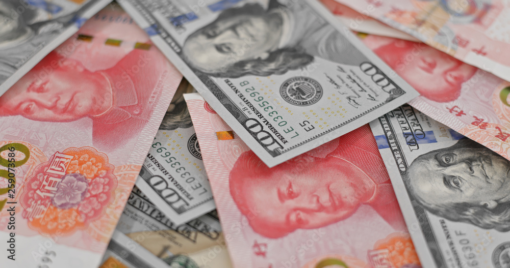 Obraz premium Stack of chinese RMB and USD banknote