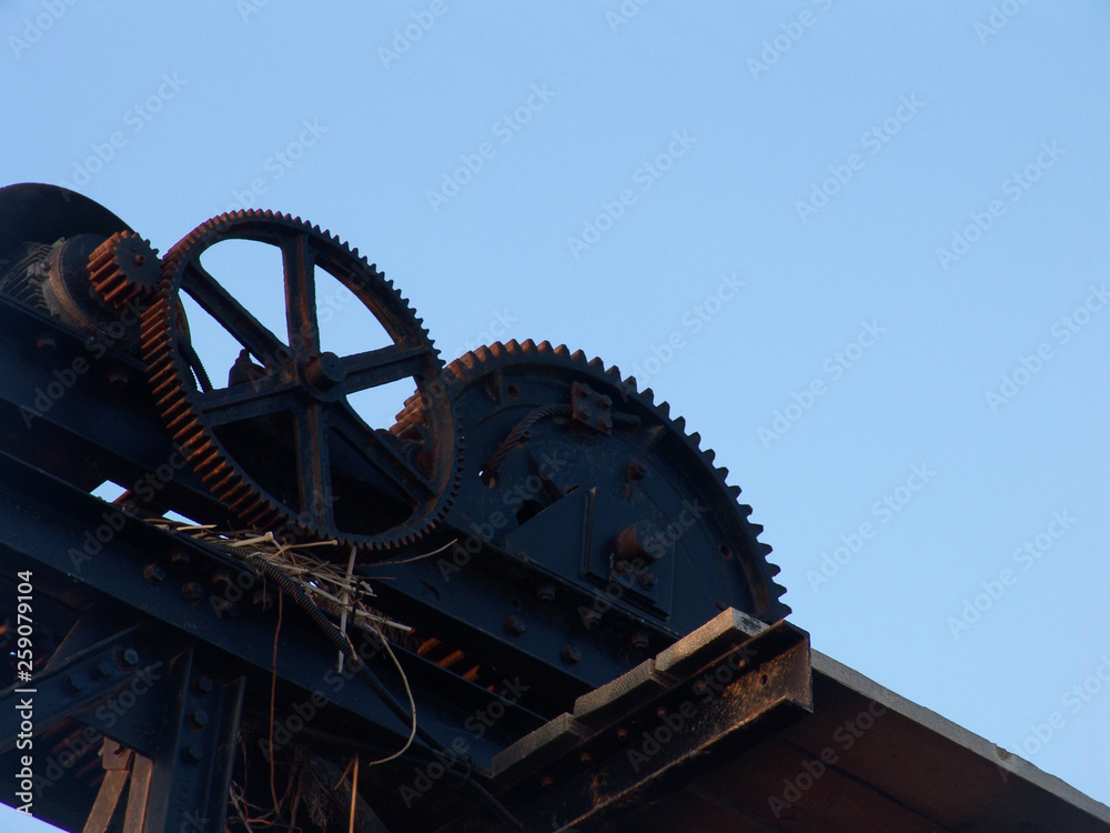 Cogs big structure standing against the blue sky in Tel Aviv port, Israel