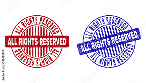 Grunge ALL RIGHTS RESERVED round stamp seals isolated on a white background. Round seals with grunge texture in red and blue colors.