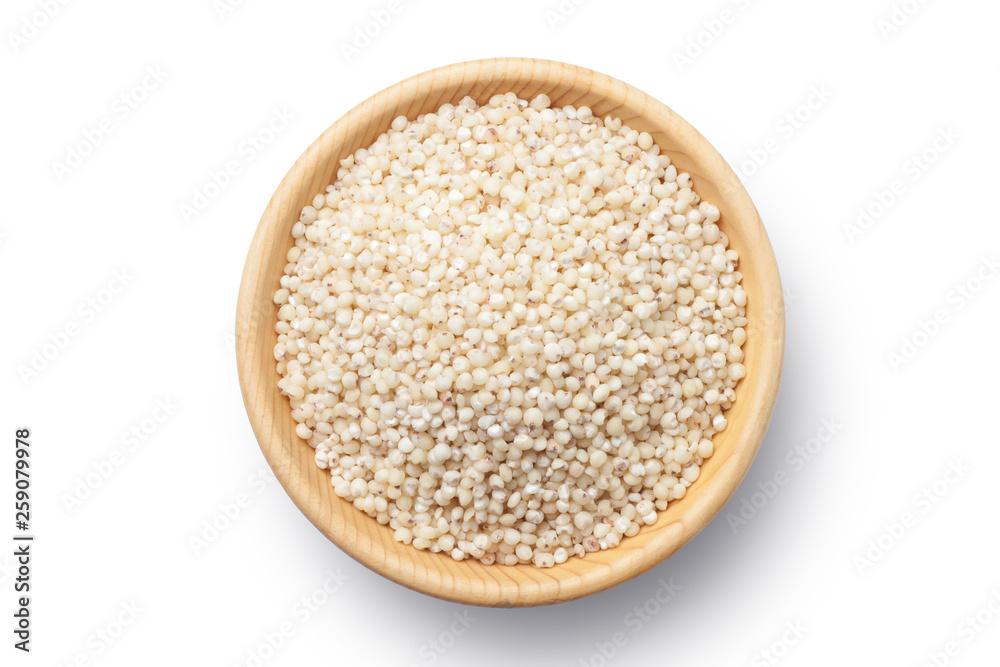 Sorghum rice in a wooden bowl isolated on white background. Top view. Sorghum rice in a wooden bowl isolated on white background. Top view.