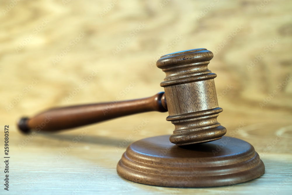 Law and justice concept image. Brown wooden background Law and justice concept image. Brown wooden background