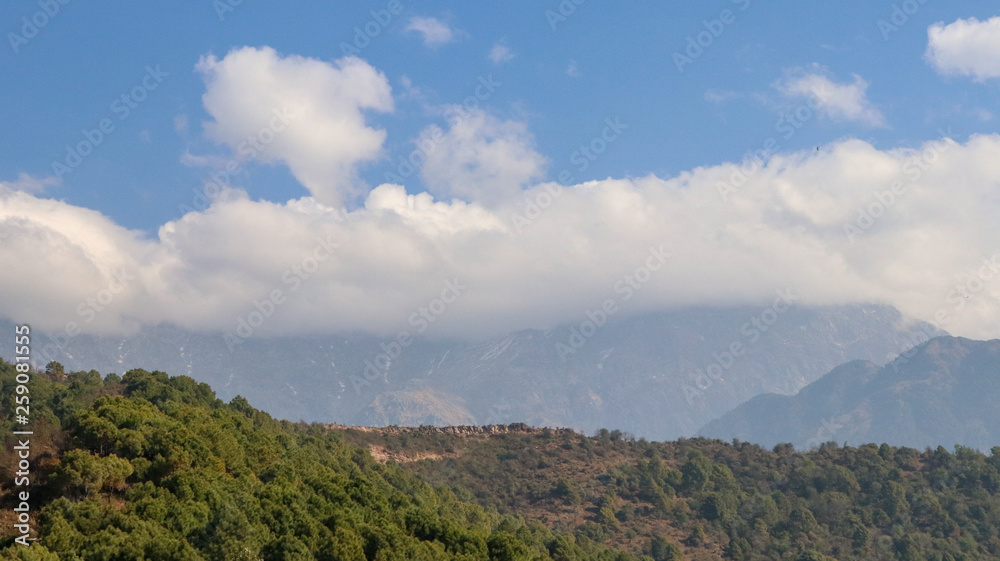 Clouds over Mountains, Landscape in the mountains, View from the Indrunag, Dharmashala, Himachal Pradesh, India.