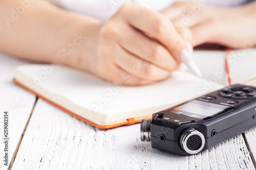 Voice recorder using as a tool for taking notes in high school or university photo