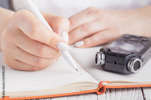 Voice recorder using as a tool for taking notes in high school or university. photo