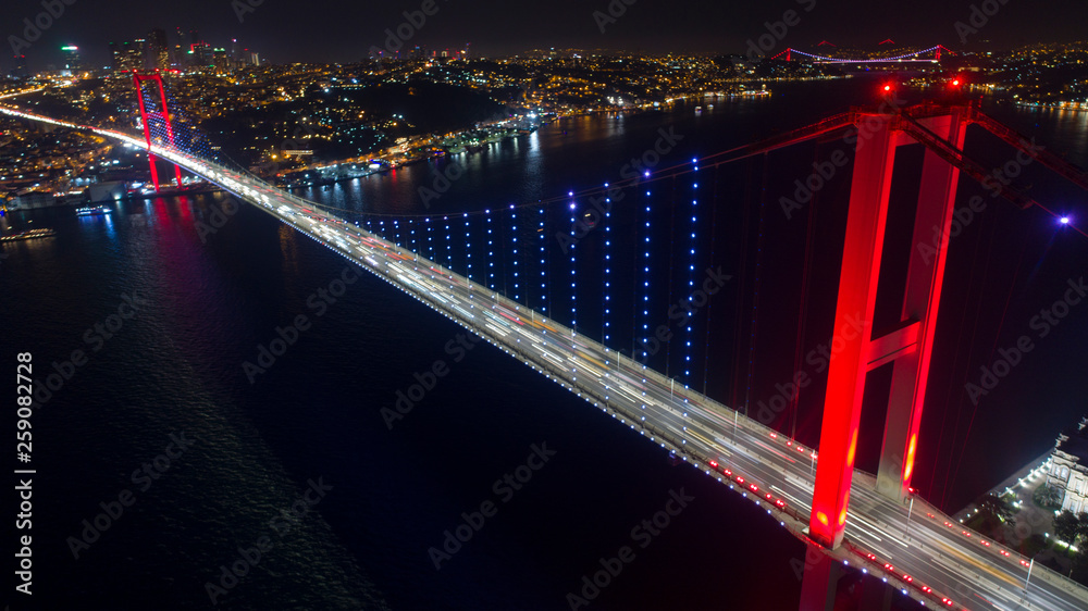 Obraz premium Aerial View of Istanbul Bosphorus Bridge at night. 15th July Martyrs Bridge - 15 Temmuz Sehitler Koprusu In Istanbul Turkey