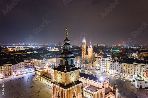 Aerial drone view Cracow old town and city main square at night.
