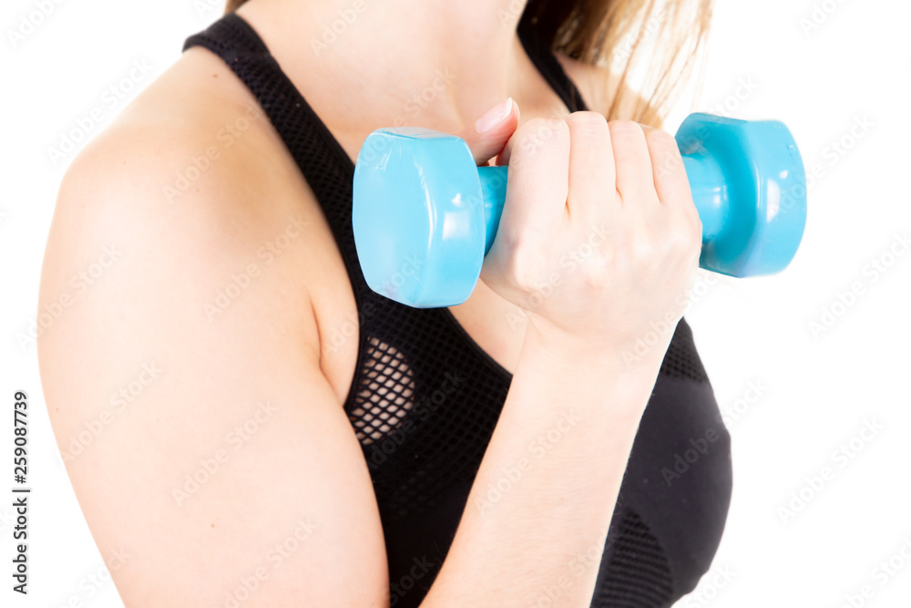 athletic woman pumping up muscles with blue dumbbells athletic woman pumping up muscles with blue dumbbells
