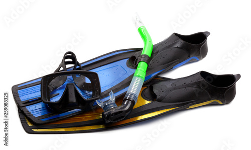 Mask, snorkel and flippers of different colors with water drops
